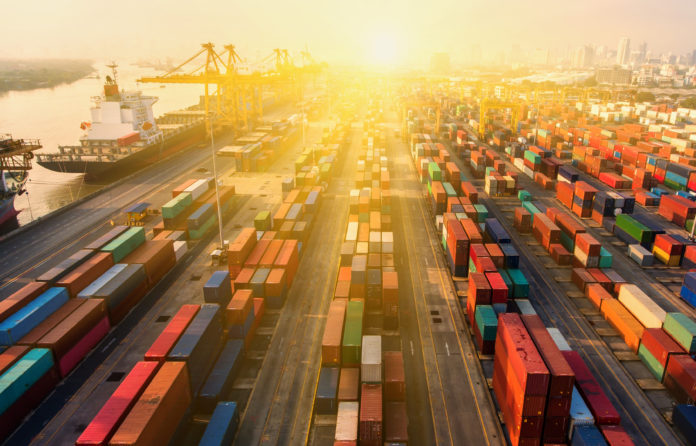 Container Ship In Import Export And Business Logistic.By Crane ,Trade Port , Shipping.cargo To Harbor.Aerial View.Top View.