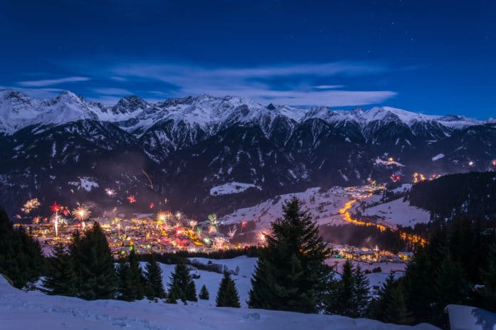 New Years Eve Fireworks Over Village Fiss In Austria With Snowy Mountains