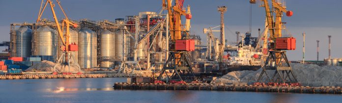Loading Grain To The Ship In The Port. Panoramic View Of The Shi